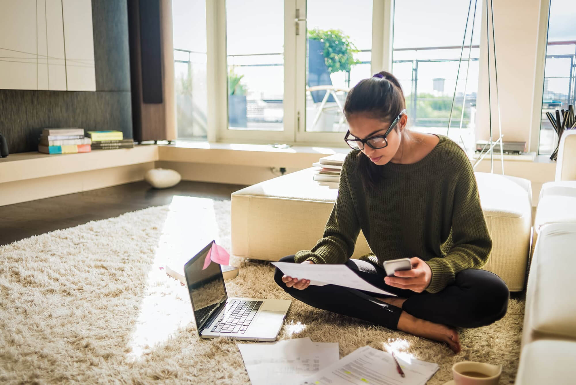 Women working from home on the floor