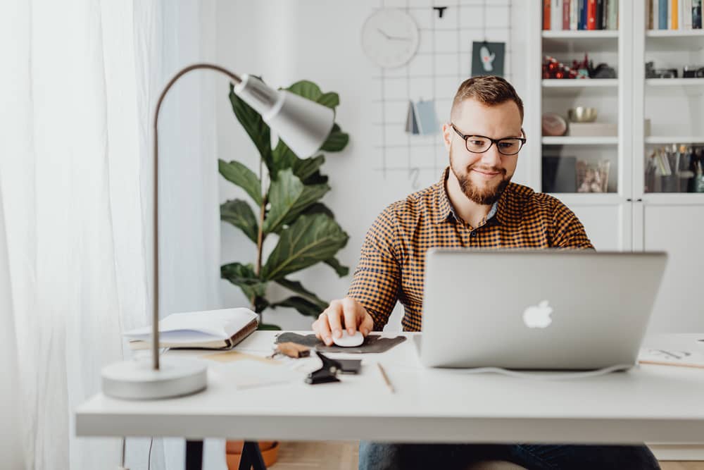 man in home office on laptop